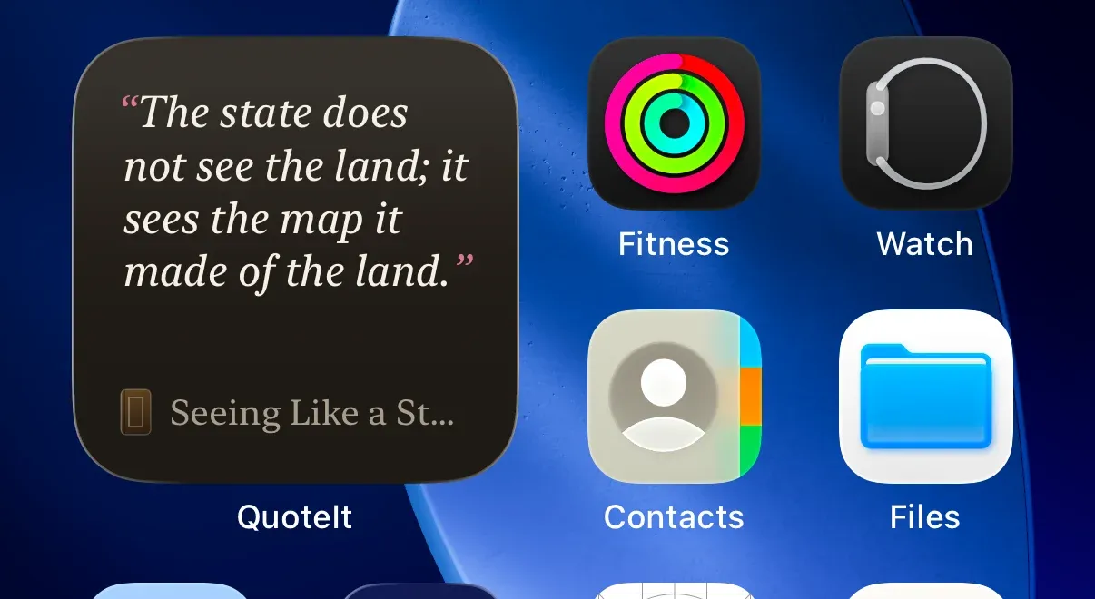 The small QuoteIt widget on a home screen, showing one bookmarked quote and the start of its book title